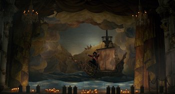 Movie still from “The Adventures of Baron Munchausen” (1988), directed by Terry Gilliam – A painting of a pirate on a ship in the middle of the night; Extreme Wide shot, High angle