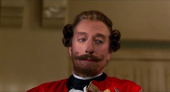 Movie still from “The Adventures of Baron Munchausen” (1988), directed by Terry Gilliam – A person wearing a costume; Close Up shot, Low angle