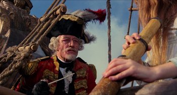 Movie still from “The Adventures of Baron Munchausen” (1988), directed by Terry Gilliam – An old man dressed as a pirate with a feather hat; Close Up shot, Low angle