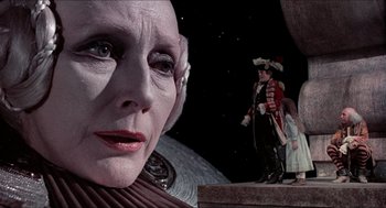 Movie still from “The Adventures of Baron Munchausen” (1988), directed by Terry Gilliam – An old woman with a strange look on her face; Close Up shot, Low angle
