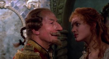 Movie still from “The Adventures of Baron Munchausen” (1988), directed by Terry Gilliam – An older man and a younger woman face to face; Close Up shot, Over the shoulder angle