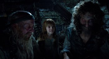 Movie still from “The Adventures of Baron Munchausen” (1988), directed by Terry Gilliam – A group of people standing next to each other in a room; Medium shot, Over the shoulder angle