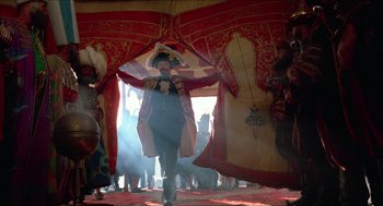 Movie still from “The Adventures of Baron Munchausen” (1988), directed by Terry Gilliam – A man dressed as a pirate in front of a tent; Wide shot, Low angle