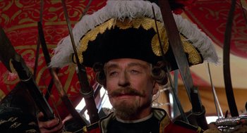 Movie still from “The Adventures of Baron Munchausen” (1988), directed by Terry Gilliam – A person wearing a hat; Close Up shot, Low angle