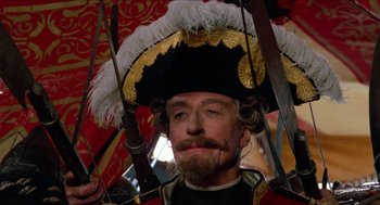 Movie still from “The Adventures of Baron Munchausen” (1988), directed by Terry Gilliam – A person wearing a hat; Close Up shot, Low angle