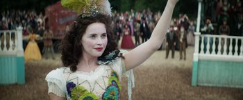 Movie still from “The Aeronauts” (2019), directed by Tom Harper – A woman in a fancy costume waving at a crowd; Close Up shot, Over the shoulder angle