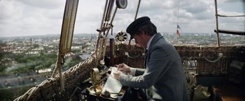 Movie still from “The Aeronauts” (2019), directed by Tom Harper – A man writing on a piece of paper on top of a boat; Medium shot, Low angle