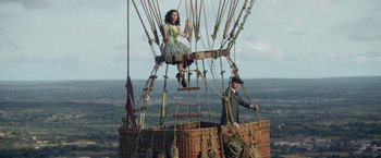 Movie still from “The Aeronauts” (2019), directed by Tom Harper – A man and a woman sitting on top of a hot air balloon; Wide shot, High angle