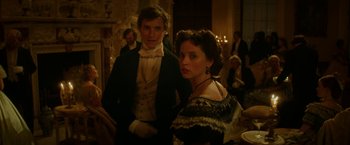 Movie still from “The Aeronauts” (2019), directed by Tom Harper – A man and a woman dressed in period clothing; Medium shot, Low angle