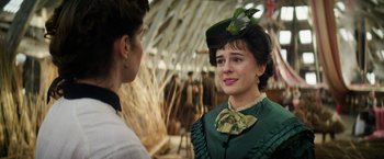 Movie still from “The Aeronauts” (2019), directed by Tom Harper – A woman in a green dress and a green hat; Close Up shot, Over the shoulder angle