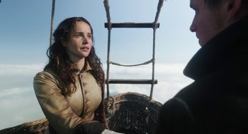 Movie still from “The Aeronauts” (2019), directed by Tom Harper – A woman sitting on top of a wooden ladder; Medium shot, Low angle