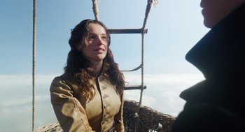 Movie still from “The Aeronauts” (2019), directed by Tom Harper – A young woman standing on top of a rope ladder; Medium shot, Low angle