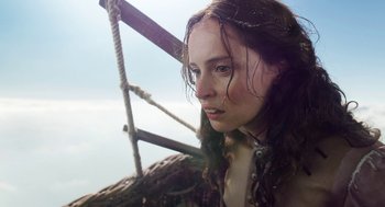 Movie still from “The Aeronauts” (2019), directed by Tom Harper – A woman with long brown hair is standing on a boat; Close Up shot, Low angle