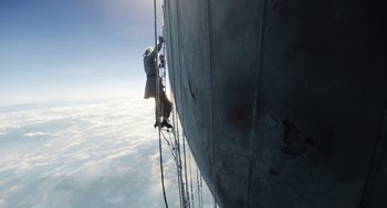 Movie still from “The Aeronauts” (2019), directed by Tom Harper – A man on a ladder on the side of a ship; Wide shot, Low angle