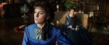 Movie still from “The Aeronauts” (2019), directed by Tom Harper – A woman in a blue dress and a man in a blue suit; Close Up shot, Low angle