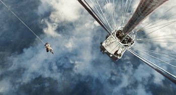 Movie still from “The Aeronauts” (2019), directed by Tom Harper – Two people are hanging from a rope in the sky; Extreme Wide shot, Overhead angle