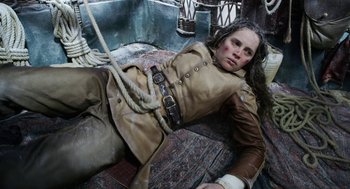 Movie still from “The Aeronauts” (2019), directed by Tom Harper – A woman laying on the ground with a rope around her neck; Medium shot, Overhead angle