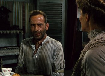 Movie still from “The African Queen” (1951), directed by John Huston – A man and a woman are talking in a room; Medium shot, Over the shoulder angle