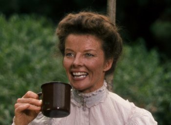 Movie still from “The African Queen” (1951), directed by John Huston – A woman holding a coffee mug in her hand; Close Up shot, Low angle