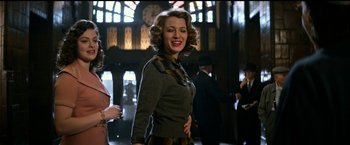 Movie still from “The Age of Adaline” (2015), directed by Lee Toland Krieger – A woman in a gray sweater and a plaid scarf; Medium shot, Low angle