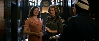 Movie still from “The Age of Adaline” (2015), directed by Lee Toland Krieger – A couple of women standing next to each other in a room; Medium shot, Low angle