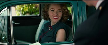 Movie still from “The Age of Adaline” (2015), directed by Lee Toland Krieger – A woman sitting in the back seat of a car looking into a mirror; Medium shot, Over the shoulder angle
