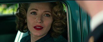 Movie still from “The Age of Adaline” (2015), directed by Lee Toland Krieger – A person in a car looking into a mirror; Close Up shot, Over the shoulder angle