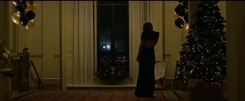 Movie still from “The Age of Adaline” (2015), directed by Lee Toland Krieger – A woman standing in front of a window at night; Wide shot, Low angle