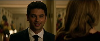 Movie still from “The Age of Adaline” (2015), directed by Lee Toland Krieger – A man in a suit and tie looking at a woman in a dress; Close Up shot, Over the shoulder angle