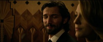 Movie still from “The Age of Adaline” (2015), directed by Lee Toland Krieger – A person wearing a suit and tie; Close Up shot, Over the shoulder angle