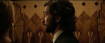 Movie still from “The Age of Adaline” (2015), directed by Lee Toland Krieger – A person wearing a suit and tie; Close Up shot, Over the shoulder angle