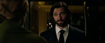 Movie still from “The Age of Adaline” (2015), directed by Lee Toland Krieger – A person wearing a suit and tie; Close Up shot, Over the shoulder angle