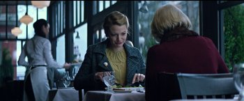 Movie still from “The Age of Adaline” (2015), directed by Lee Toland Krieger – A woman sitting at a table with a plate of food; Medium shot, Over the shoulder angle