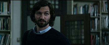 Movie still from “The Age of Adaline” (2015), directed by Lee Toland Krieger – A person with long hair and a beard; Close Up shot, Over the shoulder angle