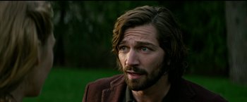 Movie still from “The Age of Adaline” (2015), directed by Lee Toland Krieger – A person with long hair and a beard; Close Up shot, Over the shoulder angle