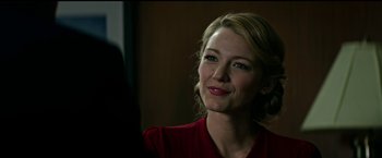 Movie still from “The Age of Adaline” (2015), directed by Lee Toland Krieger – A woman in a red shirt is smiling for the camera; Close Up shot, Over the shoulder angle
