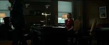 Movie still from “The Age of Adaline” (2015), directed by Lee Toland Krieger – A woman sitting at a desk in front of a window; Wide shot, Low angle