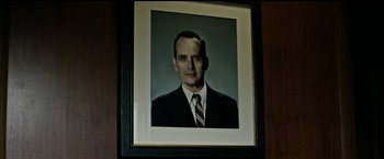 Movie still from “The Age of Adaline” (2015), directed by Lee Toland Krieger – An old photo of a man in a suit and tie; Close Up shot, Low angle