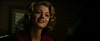 Movie still from “The Age of Adaline” (2015), directed by Lee Toland Krieger – A woman with blonde curly hair smiling for the camera; Close Up shot, Low angle