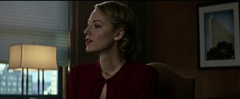 Movie still from “The Age of Adaline” (2015), directed by Lee Toland Krieger – A woman in a red shirt sitting in front of a window; Close Up shot, Low angle