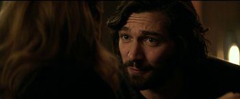 Movie still from “The Age of Adaline” (2015), directed by Lee Toland Krieger – A person with long hair and a beard; Close Up shot, Over the shoulder angle