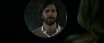 Movie still from “The Age of Adaline” (2015), directed by Lee Toland Krieger – A man with long hair looking into a mirror; Close Up shot, Over the shoulder angle