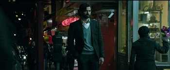 Movie still from “The Age of Adaline” (2015), directed by Lee Toland Krieger – A man in a suit walking down a hallway; Medium shot, Low angle