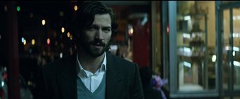 Movie still from “The Age of Adaline” (2015), directed by Lee Toland Krieger – A person wearing a suit and tie; Close Up shot, Over the shoulder angle