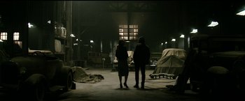 Movie still from “The Age of Adaline” (2015), directed by Lee Toland Krieger – Two people are standing in an abandoned warehouse; Wide shot, Low angle