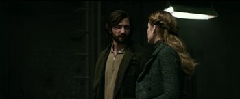 Movie still from “The Age of Adaline” (2015), directed by Lee Toland Krieger – A man and a woman standing next to each other in front of a building; Medium shot, Over the shoulder angle