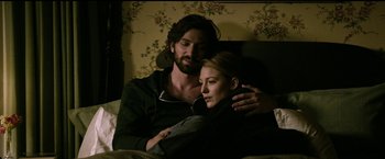 Movie still from “The Age of Adaline” (2015), directed by Lee Toland Krieger – A man and a woman sitting on a bed; Medium shot, Overhead angle