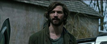 Movie still from “The Age of Adaline” (2015), directed by Lee Toland Krieger – A person with long hair and a beard; Close Up shot, Over the shoulder angle