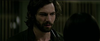 Movie still from “The Age of Adaline” (2015), directed by Lee Toland Krieger – A person with long hair and a beard; Close Up shot, Over the shoulder angle