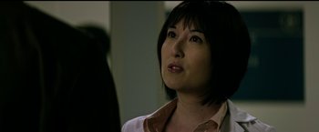 Movie still from “The Age of Adaline” (2015), directed by Lee Toland Krieger – A person with short black hair; Close Up shot, Over the shoulder angle